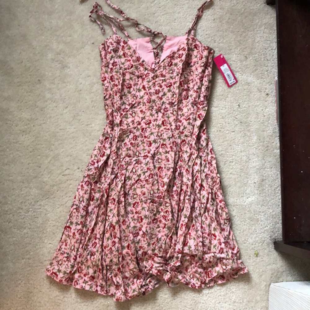 Brand new with tags. Cute sun dress!